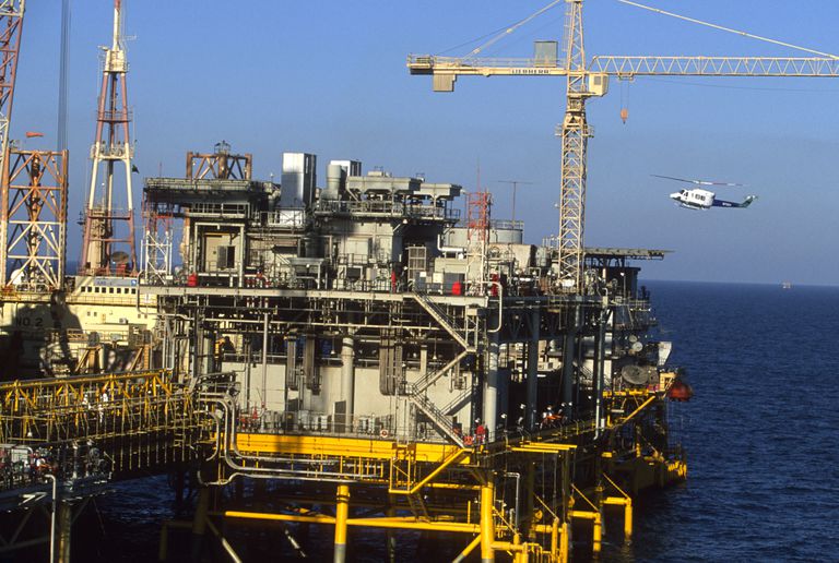 PERSIAN GULF, SAUDI ARABIA - MARCH 2003:  A General View as an Aramco (Saudi national oil company) helicopter lands on a helipad on the offshore oil rig "Marjan 2" in the Persian Gulf on March 2003 in Persian Gulf, Saudi Arabia. (Photo by Reza/Getty Images)